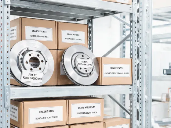 Brake parts warehouse shelf with labeled boxes